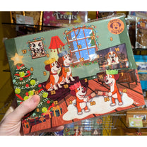 Image shows an Advent Calendar for dogs, with a doggy family scene, branded David's Dog Deli