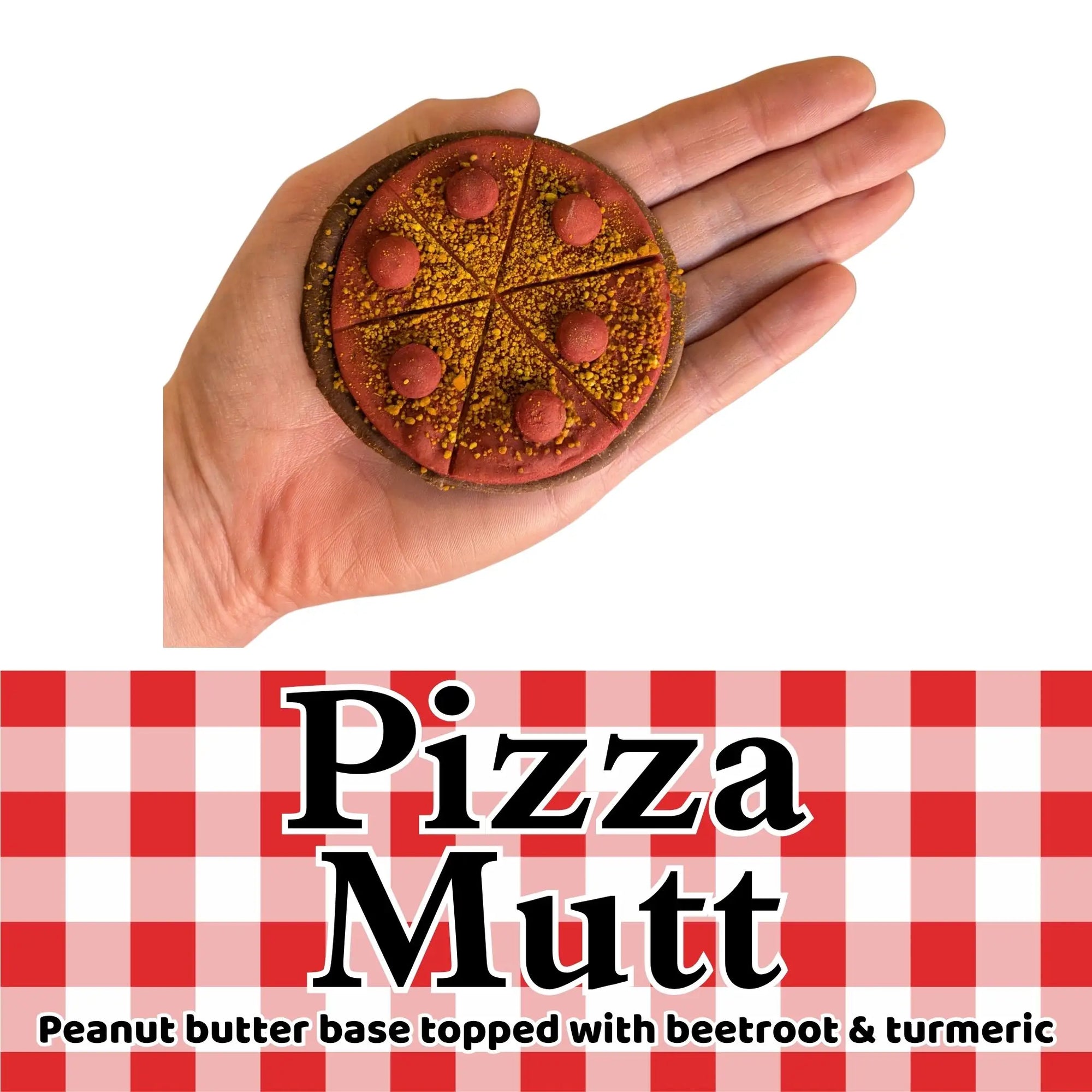 pizza mutt dog treat in a hand