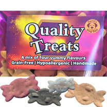 A bag of dog treats with a colorful label reading 'Quality Treats' and a circular 'David's Dog Deli' logo, shown above several sweetie-shaped treats in beetroot, blueberry & apple, peanut butter & banana and carob & peanut butter, on a white background.