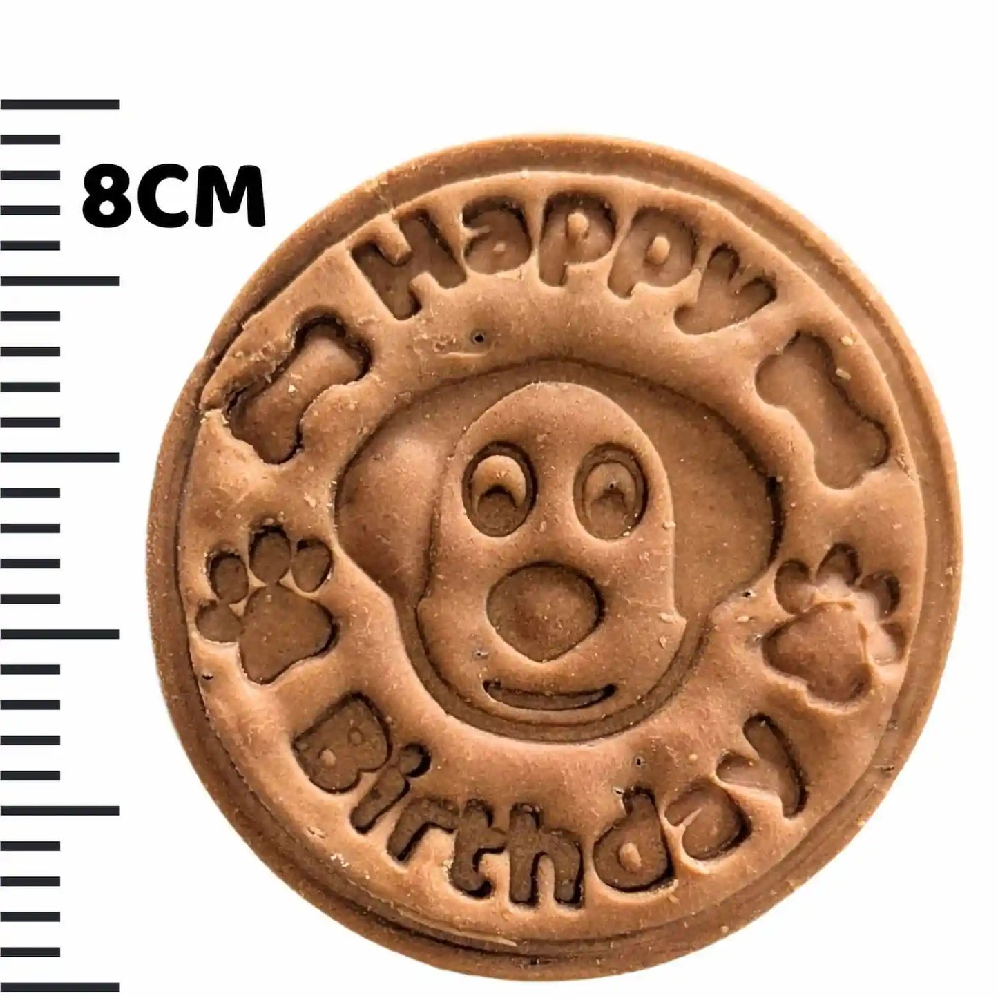 Round brown stamp with 'Happy Birthday' and paw prints, next to a 8cm ruler.
