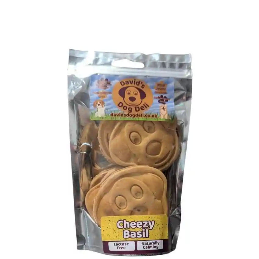 Pack of dog treats labeled 'Cheezy Basil' with David's Dog Deli branding on a white background.