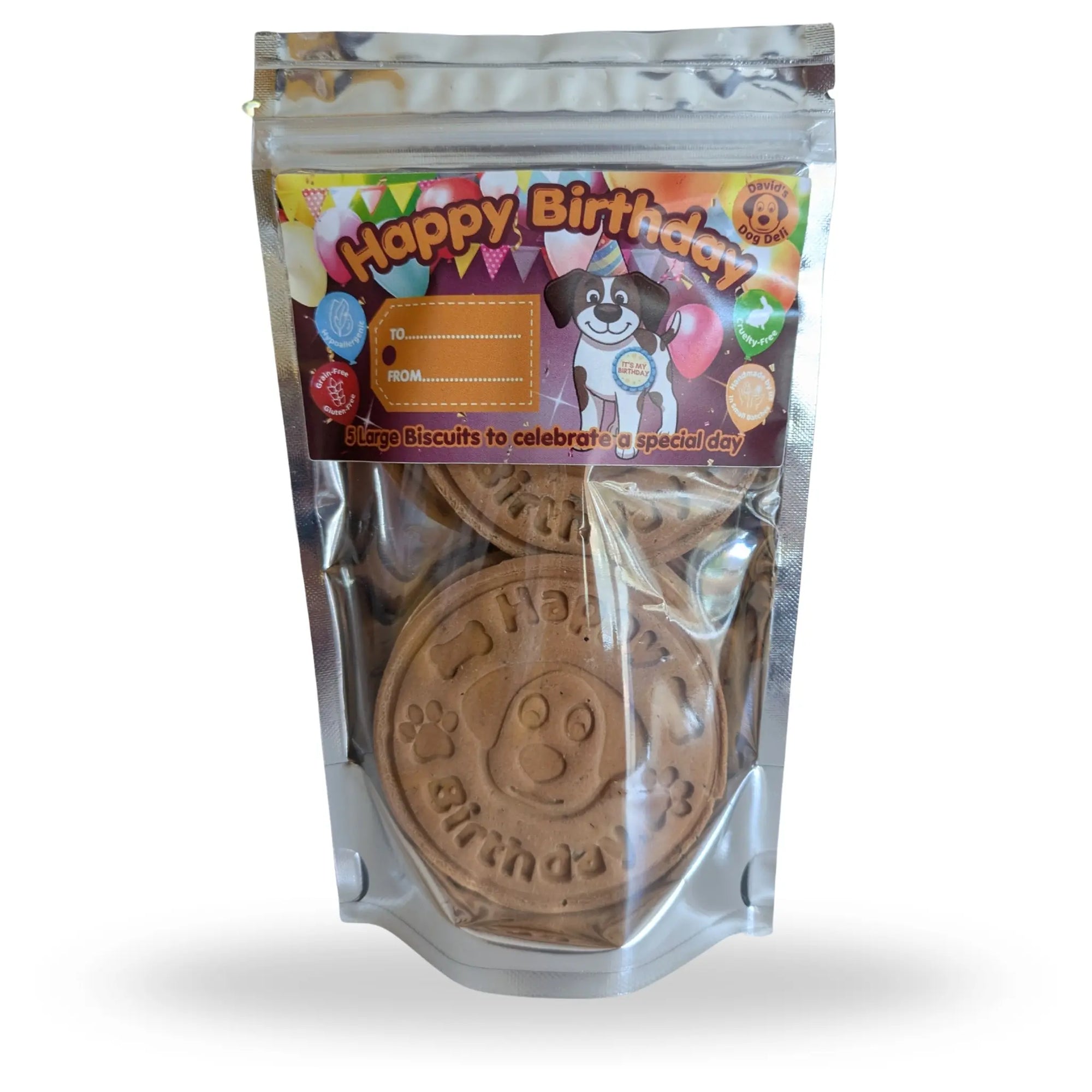 A stand-up resealable pouch of dog birthday biscuits. The clear plastic bag shows round brown biscuits stamped with 'Happy Birthday' and paw prints.