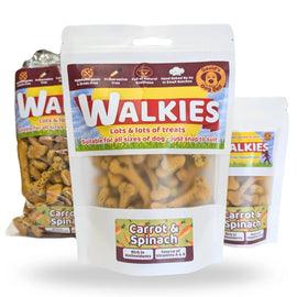 Three bags of Walkies dog treats arranged together on a white background, with the center bag labeled Carrot & Spinach in a clear stand-up pouch and the side bags in sealed packaging.