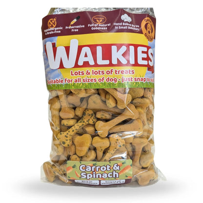 A bag of Walkies Carrot & Spinach dog treats, showing the brown and yellow packaging with a clear lower section displaying the bone-shaped treats inside, on a white background.